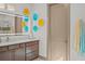 Stylish bathroom with LED mirror, a modern vanity, and decorative wall art at 17702 Cresswind Ter, Bradenton, FL 34211