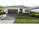 Charming single-story home with a two-car garage and professionally landscaped front yard at 17702 Cresswind Ter, Bradenton, FL 34211