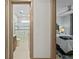 Hallway view showcasing the entrance to a bathroom and bedroom at 17702 Cresswind Ter, Bradenton, FL 34211
