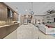 Modern kitchen featuring a large quartz island, stainless steel appliances, and an open concept design at 17702 Cresswind Ter, Bradenton, FL 34211