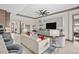 Comfortable living room with stylish seating, open concept design, and seamless flow to the kitchen at 17702 Cresswind Ter, Bradenton, FL 34211