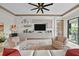 Stylish living room with elegant furnishings, modern decor, and access to an outdoor patio at 17702 Cresswind Ter, Bradenton, FL 34211