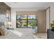 Bright bedroom with views of the outdoor lanai, modern decor and neutral design at 17702 Cresswind Ter, Bradenton, FL 34211