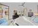 Bright bedroom featuring a walk in closet and view to the main bathroom and kitchen at 17702 Cresswind Ter, Bradenton, FL 34211