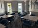 Comfortable meeting room with multiple tables and natural light creates a welcoming atmosphere at 17702 Cresswind Ter, Bradenton, FL 34211
