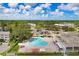 Aerial view of community pool and surrounding buildings at 2434 Australia E Way # 42, Clearwater, FL 33763