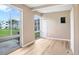 Bright bedroom with wood-look floors and large windows at 2434 Australia E Way # 42, Clearwater, FL 33763