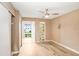 Bright bedroom with wood-look floors and ceiling fan at 2434 Australia E Way # 42, Clearwater, FL 33763