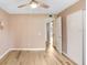 Spacious bedroom with wood-look floors and access to bathroom at 2434 Australia E Way # 42, Clearwater, FL 33763
