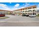 Two-story condo building with parking and landscaped grounds at 2434 Australia E Way # 42, Clearwater, FL 33763