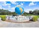 Large globe monument in landscaping at 2434 Australia E Way # 42, Clearwater, FL 33763