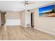 Light and airy living room with wood-look floors and ceiling fan at 2434 Australia E Way # 42, Clearwater, FL 33763