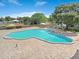 Community pool with surrounding patio and shade umbrellas at 2434 Australia E Way # 42, Clearwater, FL 33763