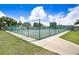Outdoor tennis courts with green fencing at 2434 Australia E Way # 42, Clearwater, FL 33763
