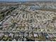 Aerial view of residential neighborhood, showcasing numerous homes and landscape at 3105 Pinon Dr, Holiday, FL 34691