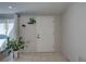 Clean entryway with tiled floors and potted plants at 3105 Pinon Dr, Holiday, FL 34691