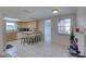 Bright kitchen with light wood cabinets and view to backyard at 3105 Pinon Dr, Holiday, FL 34691