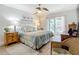 Main bedroom with wood floors and sliding glass door to patio at 3397 Hyde Park Dr, Clearwater, FL 33761