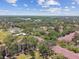 Picturesque aerial view of the community's buildings surrounded by lush greenery, showcasing a blend of residential living and nature at 5606 Pinnacle Heights Cir # 304, Tampa, FL 33624