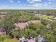 Expansive view of community buildings and lush trees, showcasing serene living environment with nature and well-maintained surroundings at 5606 Pinnacle Heights Cir # 304, Tampa, FL 33624