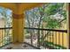 Relaxing balcony overlooking mature trees and manicured grounds at 5606 Pinnacle Heights Cir # 304, Tampa, FL 33624