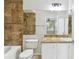 Bathroom featuring a vanity with solid surface counter and tiled tub with shower at 5606 Pinnacle Heights Cir # 304, Tampa, FL 33624