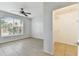 Bedroom featuring a ceiling fan, natural light, tiled floors, and closet at 5606 Pinnacle Heights Cir # 304, Tampa, FL 33624