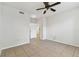 Bedroom with tiled floors, ceiling fan, and a door leading to another room at 5606 Pinnacle Heights Cir # 304, Tampa, FL 33624