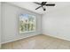 Bedroom featuring a ceiling fan, natural light, and tiled floors at 5606 Pinnacle Heights Cir # 304, Tampa, FL 33624