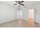 Neutral bedroom with tile floors, ceiling fan, and view of bathroom and walk-in closet at 5606 Pinnacle Heights Cir # 304, Tampa, FL 33624