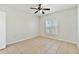 Bedroom featuring neutral wall paint, tile flooring, and a bright window at 5606 Pinnacle Heights Cir # 304, Tampa, FL 33624