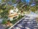 Welcoming entrance to The Pinnacle community featuring well-maintained landscaping and mature trees at 5606 Pinnacle Heights Cir # 304, Tampa, FL 33624