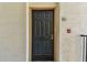 Close-up of a front door featuring unit number, knocker, and secure entry at 5606 Pinnacle Heights Cir # 304, Tampa, FL 33624