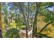 Scenic view of a lake and landscaping from a residential building, featuring lush greenery and a serene environment at 5606 Pinnacle Heights Cir # 304, Tampa, FL 33624