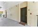Inviting hallway with unit number, fire alarm, and view of the complex at 5606 Pinnacle Heights Cir # 304, Tampa, FL 33624