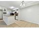 Cozy kitchen and dining area featuring essential appliances and a functional breakfast bar at 5606 Pinnacle Heights Cir # 304, Tampa, FL 33624