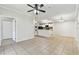 Spacious living room with an open kitchen and tile floors at 5606 Pinnacle Heights Cir # 304, Tampa, FL 33624