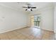 Living room with tile floors and ceiling fan at 5606 Pinnacle Heights Cir # 304, Tampa, FL 33624