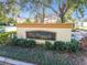 Community sign with lush landscaping and well-maintained grounds at 5606 Pinnacle Heights Cir # 304, Tampa, FL 33624