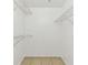 A view into a closet with wire shelving for optimal storage at 5606 Pinnacle Heights Cir # 304, Tampa, FL 33624