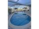 Relaxing kidney-shaped pool with screened enclosure and patio at 6526 Bimini Ct, Apollo Beach, FL 33572