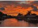 Stunning sunset over calm waters and waterfront homes at 6526 Bimini Ct, Apollo Beach, FL 33572