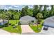 Aerial view showcasing the home's manicured lawn, landscaping, and overall curb appeal at 11116 Jenkins Ct, San Antonio, FL 33576