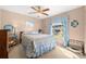 Bedroom with window and light-blue bedding at 11116 Jenkins Ct, San Antonio, FL 33576
