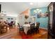 Spacious dining room with hardwood floors, and view into living room at 11116 Jenkins Ct, San Antonio, FL 33576