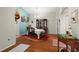 Bright dining room features hardwood floors, a charming table, and a beautiful chandelier at 11116 Jenkins Ct, San Antonio, FL 33576