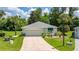 Beautiful single-story home with a two-car garage and lush landscaping at 11116 Jenkins Ct, San Antonio, FL 33576