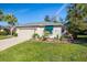 Single-story house with attached garage and well-manicured lawn at 11116 Jenkins Ct, San Antonio, FL 33576