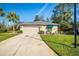 Front view of a single-story house with a landscaped yard at 11116 Jenkins Ct, San Antonio, FL 33576