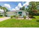 Attractive single-story home with well-kept landscaping, featuring a beautiful lawn at 11116 Jenkins Ct, San Antonio, FL 33576